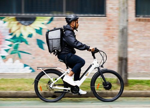 man rides an SG fleet E-bike