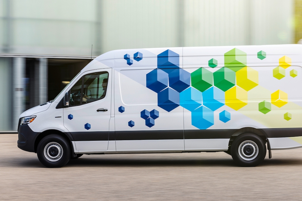 A side image of the new EV Sprinter in motion